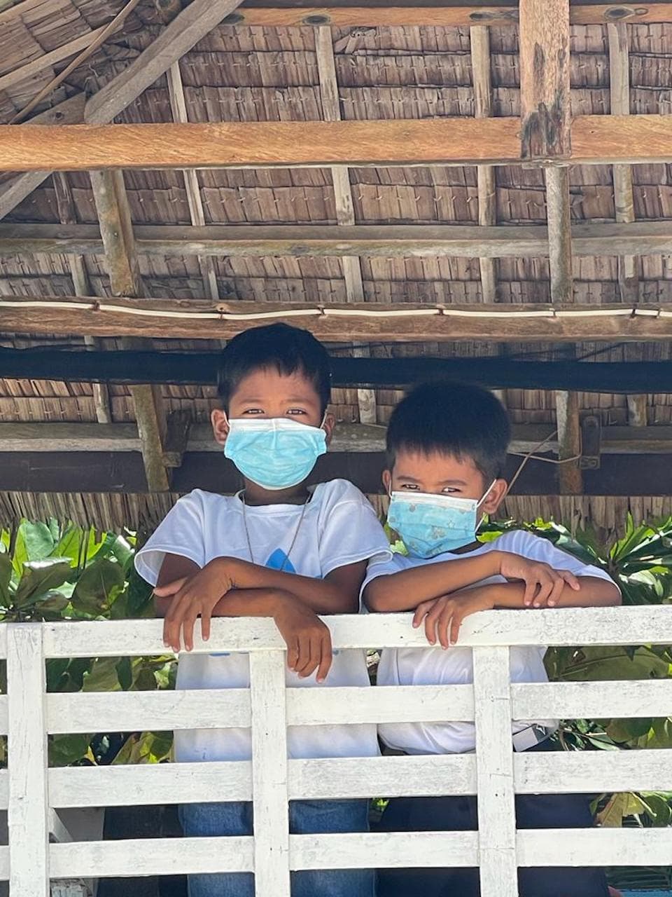 Two young boys wearing masks during the COVID-19 pandemic